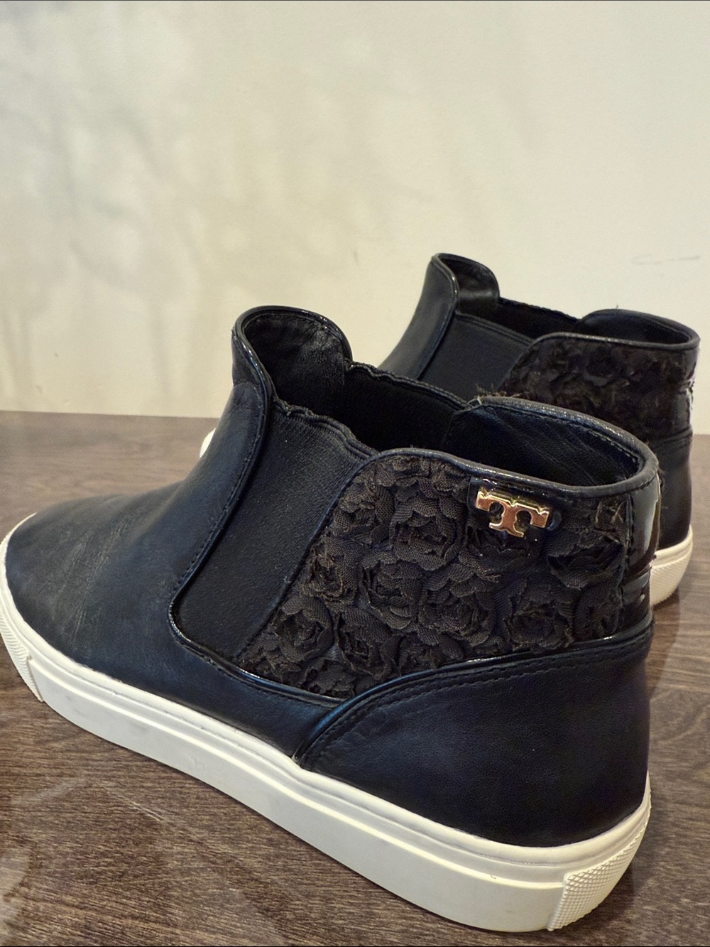 Women Black Slip-On Leather Sneakers with White Sole. Tory Burch
